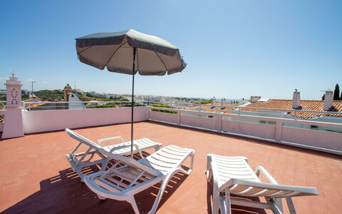 Azul: Sky, Furniture, Table, Building, Umbrella, Outdoor Furniture, Shade, Wood, Chair, Sunlounger