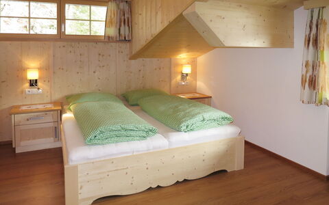 Nachbarbauer: Bedroom, Bed, Furniture, Room, Property, Bed Frame, Floor, Bed Sheet, Ceiling, Wood Flooring
