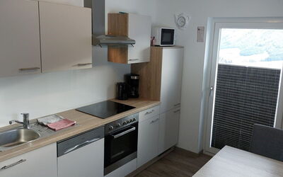 Radstadt 606: Cabinetry, Property, Furniture, Kitchen Sink, Sink, Countertop, Wood, Kitchen Stove, Interior Design, Lighting