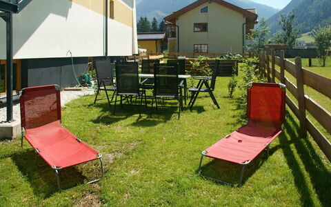 Ingrid: Sky, Property, Furniture, Building, Green, Shade, Mountain, Outdoor Furniture, Land Lot, Grass