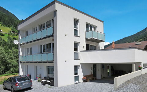 Tschiderer: Sky, Building, Property, Window, Car, Wheel, Architecture, Urban Design, Vehicle, Condominium