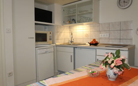Otterndorf 663: Cabinetry, Countertop, Kitchen, Wood, Interior Design, Flooring, Kitchen Stove, Sink, Floor, Kitchen Appliance