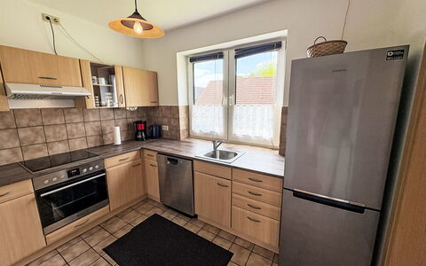 Ferienhaus Sonne: Kitchen Appliance, Kitchen, Countertop, Major Appliance, Cabinetry, Flooring, Kitchen Stove, Furniture, Wood, Home Appliance