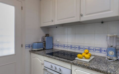 Golf Royal Delta: Countertop, Kitchen, Room, Property, Yellow, Tile, Cabinetry, Furniture, Real Estate, Floor