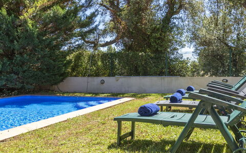 Bretos: Blue, Swimming Pool, Outdoor Furniture, Garden, Shade, Backyard, Resort, Leisure, Landscaping, Lawn