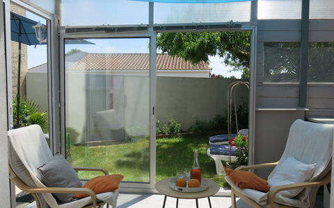 Roses Tremières: Plant, Furniture, Property, Window, Building, Chair, Shade, Interior Design, Door, Lighting