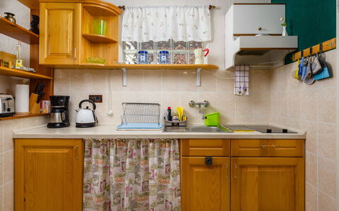 Pina: Kitchen, Cabinetry, Kitchen Appliance, Countertop, Major Appliance, Interior Design, Wood, Furniture, Yellow, Cupboard