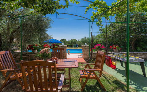 Rovinj 712: Plant, Furniture, Table, Sky, Chair, Botany, Outdoor Furniture, Shade, Outdoor Table, Building