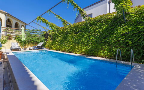 Gabi: Water, Plant, Property, Sky, Building, Blue, Swimming Pool, Azure, Shade, Window
