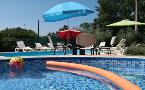 Kos: Water, Property, Sky, Building, Umbrella, Swimming Pool, Azure, Outdoor Furniture, Tree, Shade