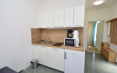 Katarina 1 606.1: Flooring, Floor, Major Appliance, Interior Design, Kitchen, Wood, Countertop, Kitchen Appliance, Furniture, Cabinetry