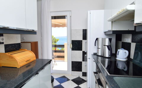 Nina: Countertop, Cabinetry, Furniture, Kitchen, Shelving, Wood, Living Room, Interior Design, Flooring, Floor