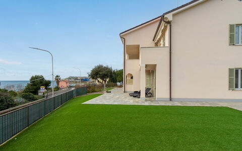 Riva Mare: Sky, Window, Building, Street Light, Grass, Tree, Plant, Land Lot, Architecture, Road Surface