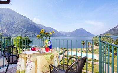 Palazzo 2 Bedroom Lake Plus 641.5: Sky, Cloud, Water, Mountain, Property, Furniture, Table, Nature, Chair, Plant