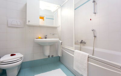 Villas 1 Bedroom Plus 641.7: Bathroom, Property, Room, Plumbing Fixture, Tap, Interior Design, Architecture, Tile, Toilet Seat, Toilet