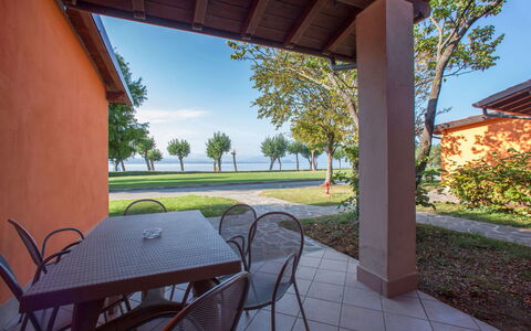 Sirmione 618: Plant, Sky, Table, Property, Building, Furniture, Tree, Shade, Wood, Chair