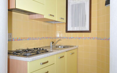 Villaggio Tivoli 635.3: Property, Room, Cabinetry, Furniture, Kitchen, Yellow, Building, Floor, Interior Design, House