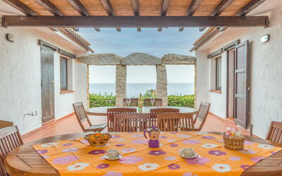 Costa Rei 651: Table, Furniture, Property, Building, Chair, Window, Plant, Azure, Couch, Wood