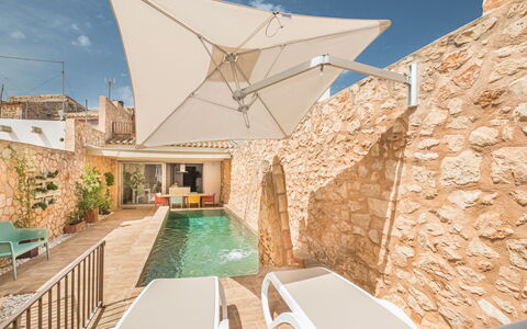 Cordella: Property, Plant, Sky, Building, Table, Shade, Outdoor Furniture, Architecture, Chair, Leisure
