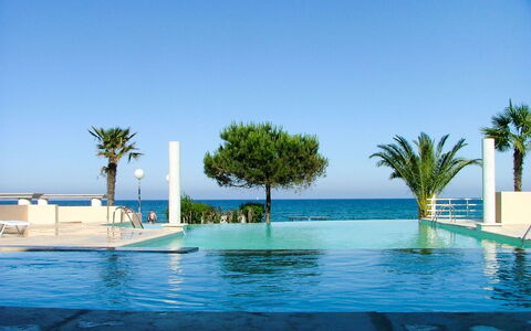 Moriani-Plage 623: Water, Sky, Blue, Swimming Pool, Tree, Arecales, Plant, Shade, Outdoor Furniture, Leisure