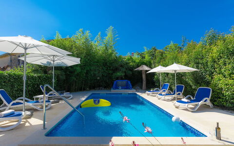 Hrelja: Water, Sky, Property, Swimming Pool, Building, Blue, Umbrella, Shade, Plant, Chair