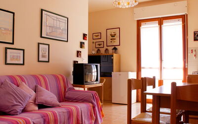 Residence Valbella (Bib601) 711.2: Room, Furniture, Living Room, Interior Design, Property, Wall, Building, Floor, Table, Yellow