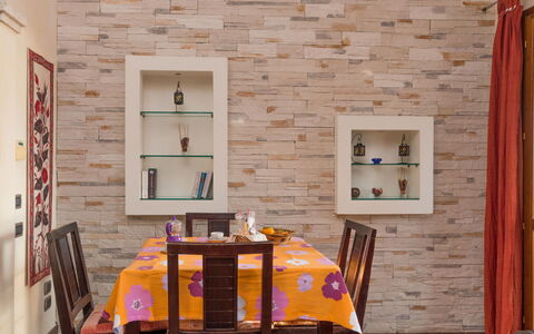 Appartamento Doria (Rei186): Furniture, Property, Table, Building, Chair, Wood, Textile, Orange, Architecture, Interior Design