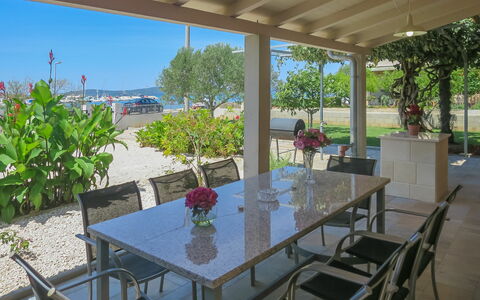 Lidija: Table, Furniture, Plant, Property, Flowerpot, Chair, Sky, Building, Tableware, Houseplant