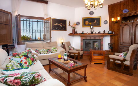 El Nido: Furniture, Property, Couch, Picture Frame, Wood, Table, Living Room, Lighting, Interior Design, Yellow