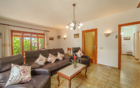 Can Damia: Couch, Property, Furniture, Table, Building, Wood, Lighting, Picture Frame, Living Room, Interior Design