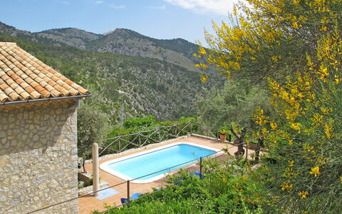 Es Barracar: Property, House, Natural Landscape, Real Estate, Swimming Pool, Estate, Mountain, Tree, Building, Home