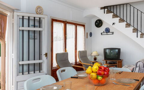 L'Escapade: Table, Furniture, Property, Tableware, Chair, Window, Picture Frame, Wood, Interior Design, Orange