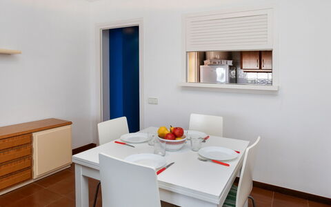 L'Escala 731: Table, Furniture, Property, Building, Wood, Interior Design, Window, Floor, Kitchen & Dining Room Table