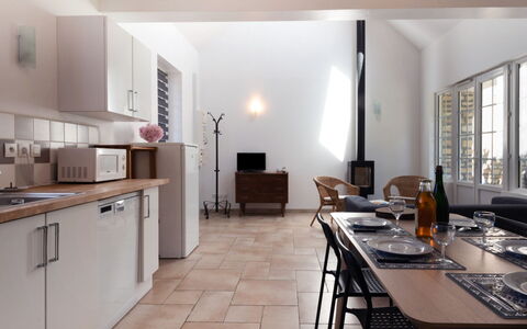 De Malau: Table, Furniture, Building, Cabinetry, Kitchen, Chair, Wood, Countertop, Window, House