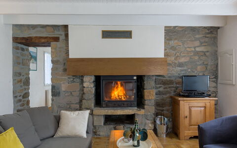Ty Coz Ar Mor: Furniture, Property, Couch, Comfort, Wood, Orange, Hearth, Living Room, Floor, Flooring