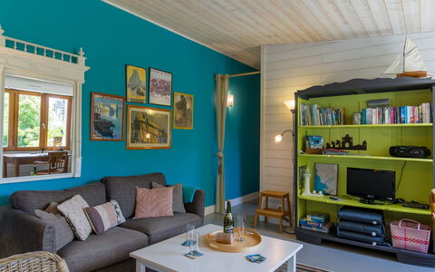 Gîte au Jardin: Furniture, Couch, Table, Azure, Picture Frame, Living Room, Shelf, Floor, Studio Couch, Wall