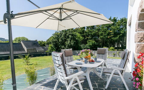 Reve de Mer: Plant, Table, Furniture, Property, Building, Sky, Chair, Outdoor Table, Shade, Outdoor Furniture