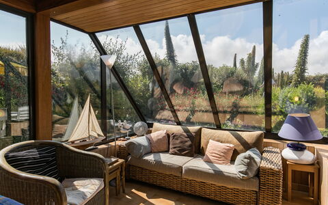 Ty Glaz: Property, Building, Couch, Shade, Sky, Plant, Wood, Interior Design, Outdoor Furniture, Living Room