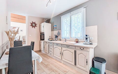 L'Estuaire: Interior Design, Furniture, Wood, Flooring, Cabinetry, Floor, Ceiling, Lighting, Room, Kitchen
