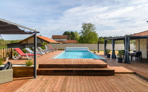 Petrocq: Sky, Cloud, Plant, Swimming Pool, Wood, Shade, Chair, Building, Sunlounger, Outdoor Furniture