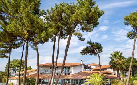 Sowell Family Pignada Plage: Building, Plant, Property, Window, Land Lot, Urban Design, Landscape, Neighbourhood, Grass, Leisure