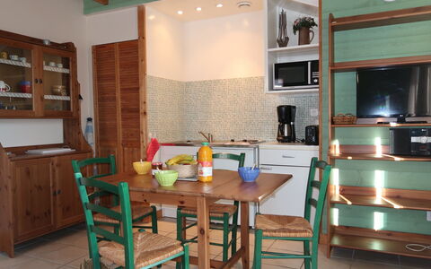 Le Chalet: Furniture, Cabinetry, Table, House, Wood, Building, Chair, Kitchen, Home Appliance, Flooring