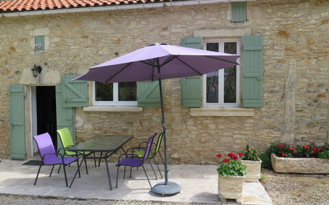 Le Coustal: Plant, Building, Window, Furniture, Table, Chair, Sky, Umbrella, Shade, Flowerpot