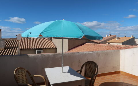 Saintes Maries de la Mer 604: Umbrella, Property, Turquoise, Shade, Sky, House, Building, Real Estate, Table, Furniture