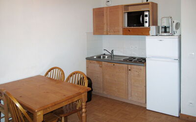 Chalets des Cimes 622.1: Room, Furniture, Property, Floor, Kitchen, Countertop, Cabinetry, Building, Hardwood, Kitchen Stove