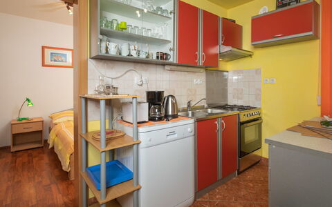 Ana: Cabinetry, Property, Countertop, Kitchen Appliance, Kitchen Stove, Kitchen, Home Appliance, Wood, Building, Flooring