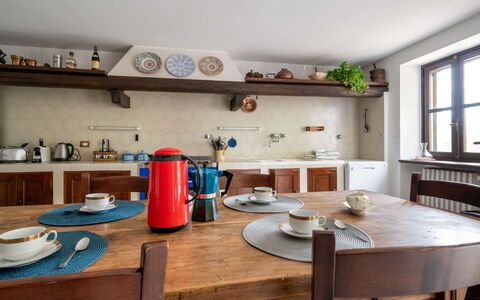 Giorgio Winery: Table, Furniture, Tableware, Cabinetry, Building, Window, Countertop, Kitchen Appliance, Kitchen, Wood