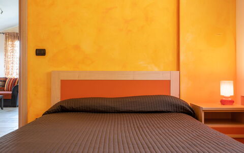 Villa Ginestra: Furniture, Bed, Bedroom, Room, Orange, Property, Bed Frame, Interior Design, Wall, Yellow