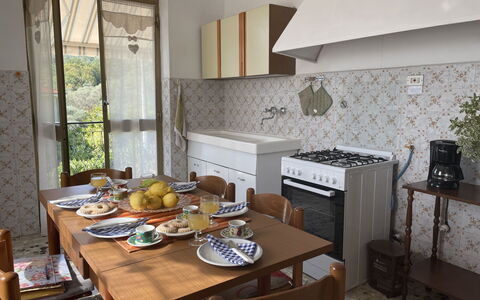 Casa Maria (Dol135): Table, Furniture, Property, Tableware, Kitchen, Wood, Exhaust Hood, Countertop, Kitchen Stove, Interior Design