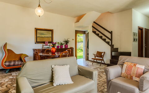 Bruna: Furniture, Couch, Picture Frame, Table, Building, Comfort, Plant, Chair, Interior Design, Living Room